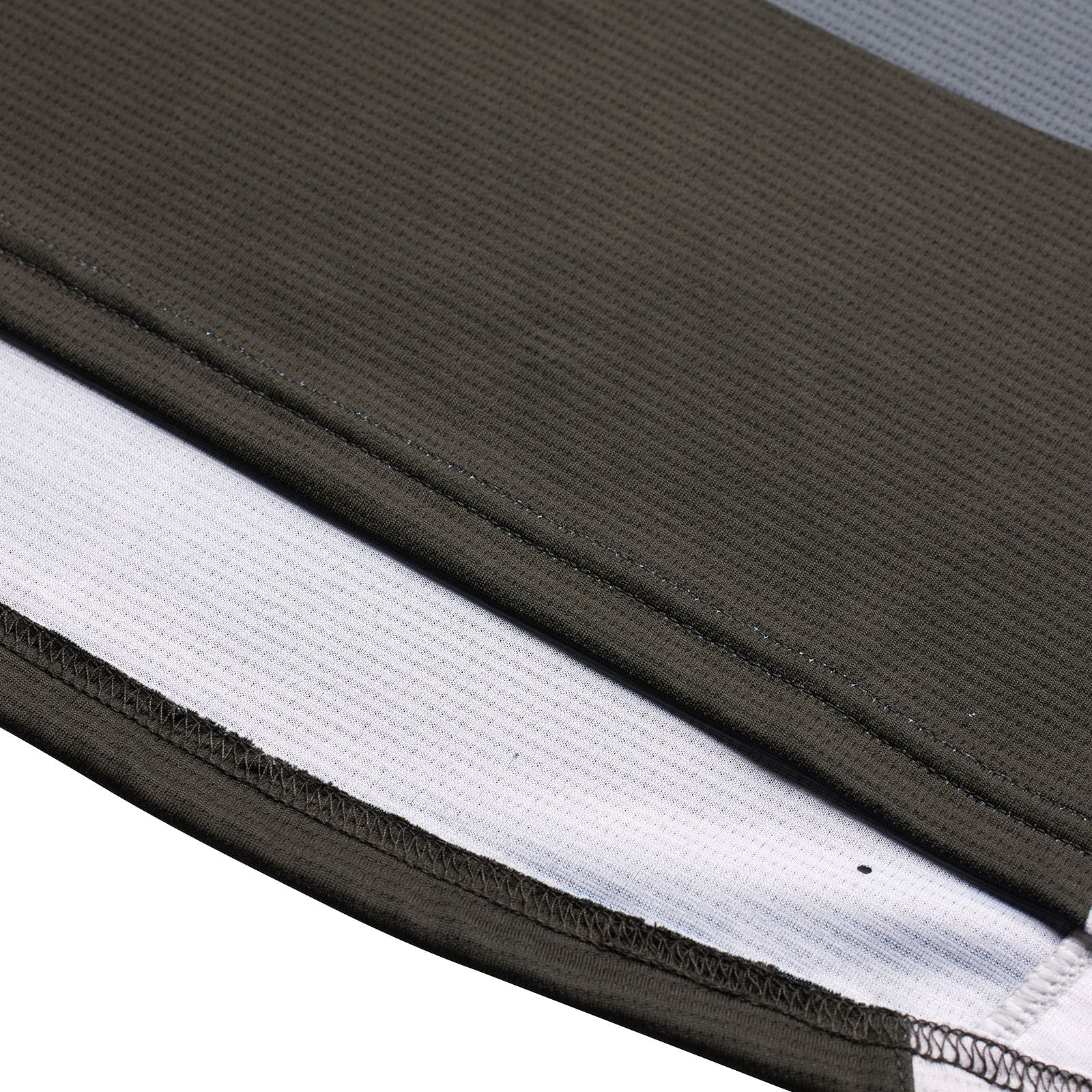 Close-up view of a TLD Youth Sprint Jersey Reverb Black BMX race jersey showing layered fabric materials with different textures and colors.