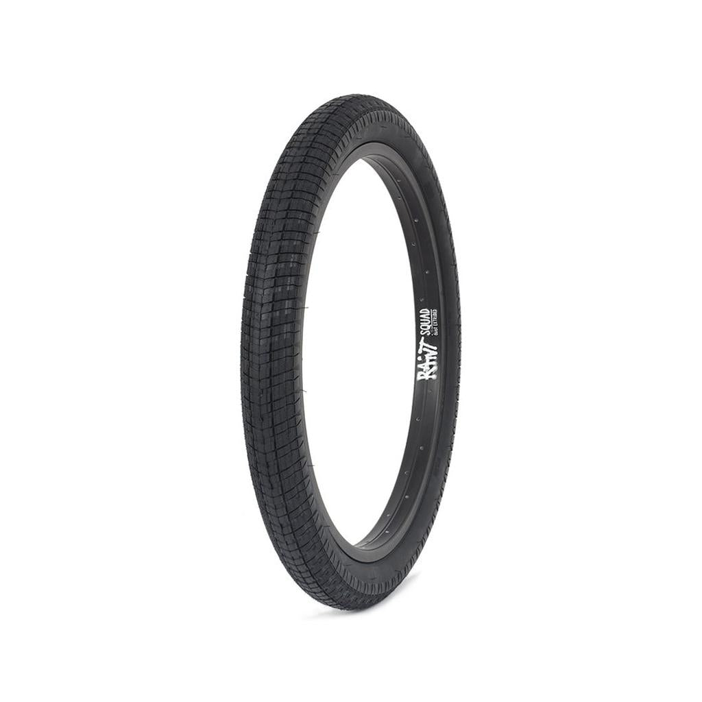 The Rant Squad 22inch Tyre, a black BMX bicycle tire featuring a textured tread pattern, stands upright against a white background.