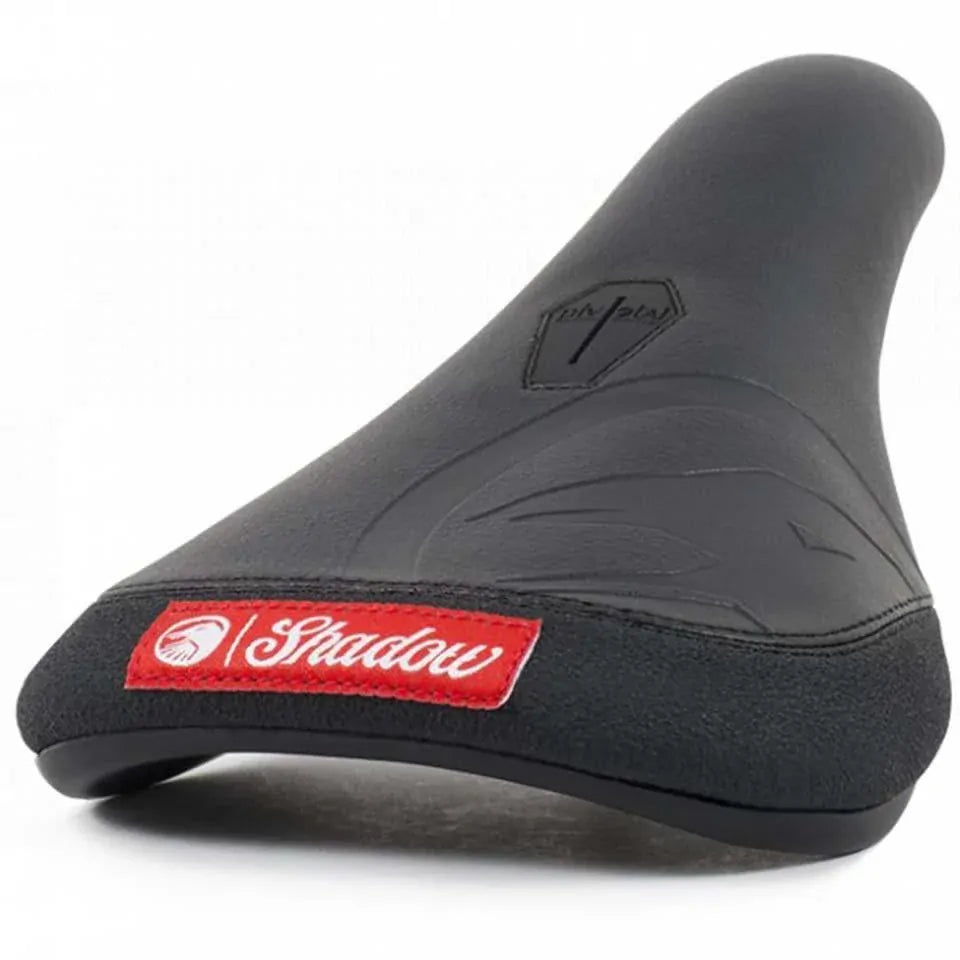 The Shadow Crow'd Pivotal Seat features a black textured synthetic leather surface, subtle embossed design, and a red "Shadow" logo patch on the front—part of the Crow'd Seats collection.