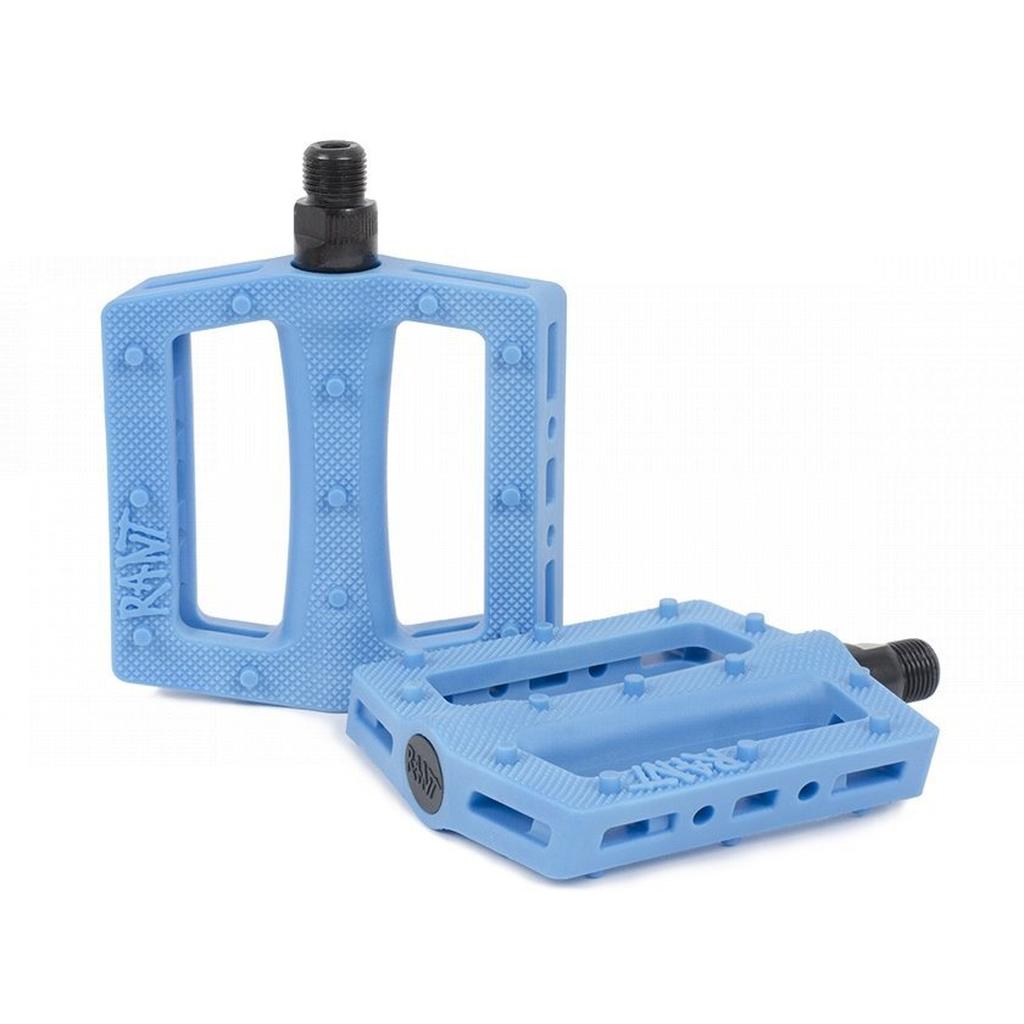 The Rant Trill Plastic Pedals, shown in light blue with textured open-frame designs and sturdy black chromoly axles, are displayed against a white background.