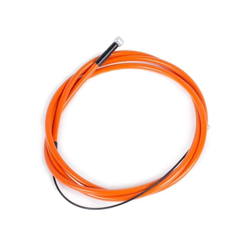 The Rant Spring Linear Brake Cable, featuring a coiled orange outer layer, black tip, and thin Teflon-coated inner wire, is shown against a white background.