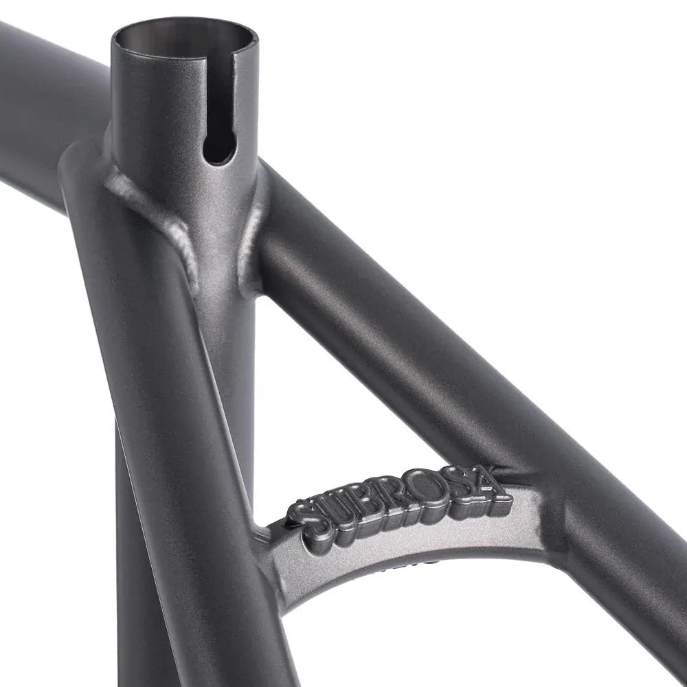 Close-up of the Subrosa Simo II Frame, a matte gray BMX frame highlighting the seat tube junction and "Subrosa" branding on the rear triangle—Simone Barraco's signature model.
