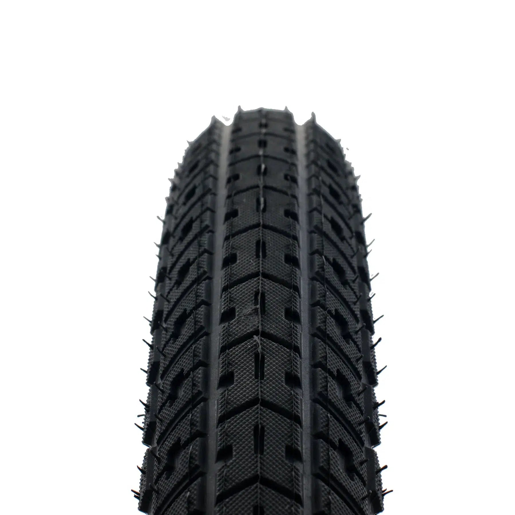 A close-up view of the United Indirect Tyre featuring a black texture-tread design and an aggressive directional dirt profile, set against a white background.
