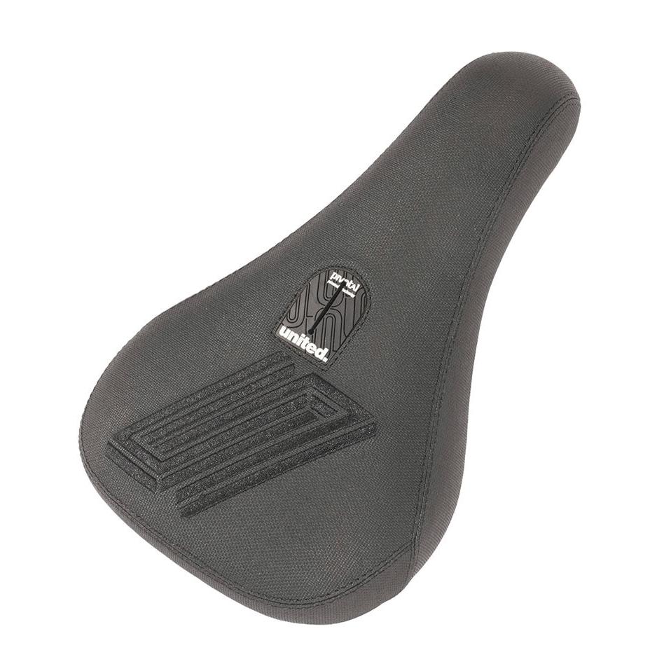 United Reborn Fat Pivotal Seat bicycle saddle with a textured cover and brand logo on the top, isolated on a white background.