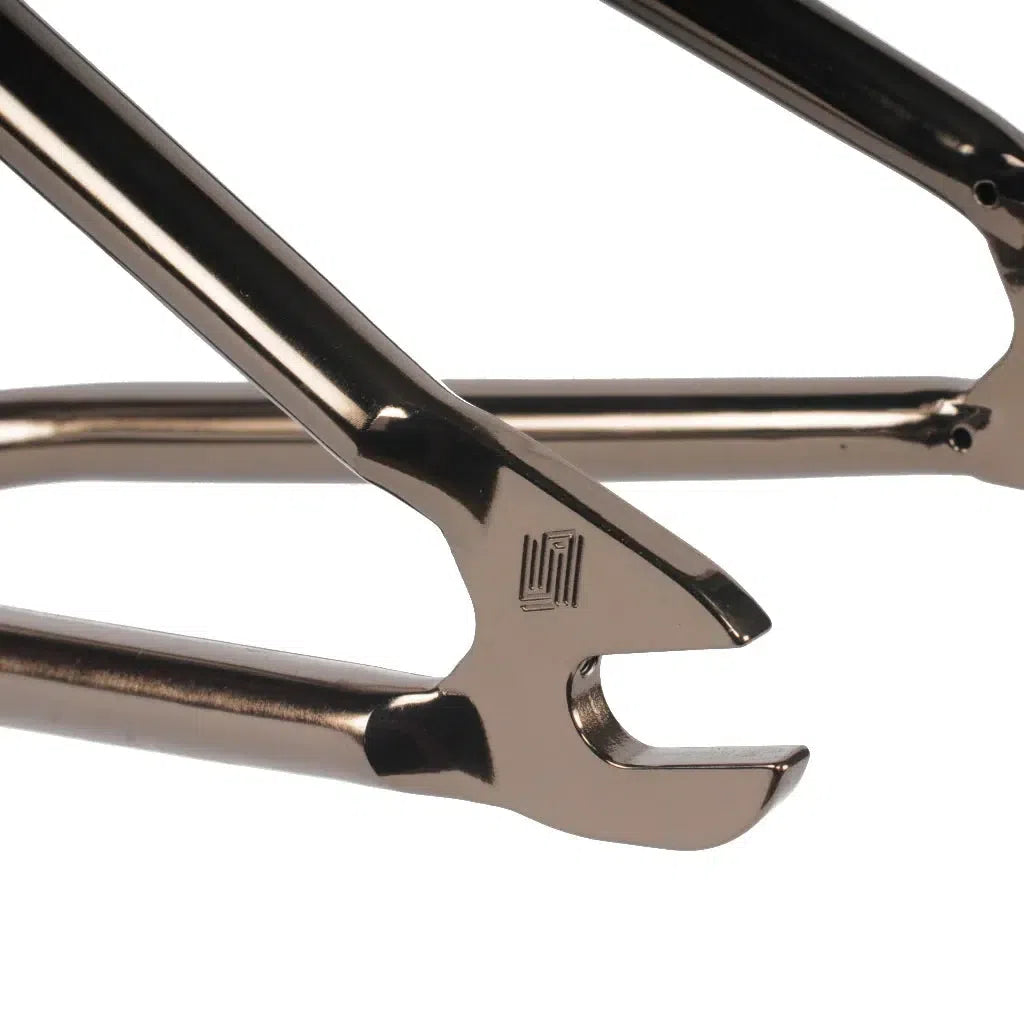 A close-up of the United Zuin Frame's metallic dropout, featuring a simple logo engraving.