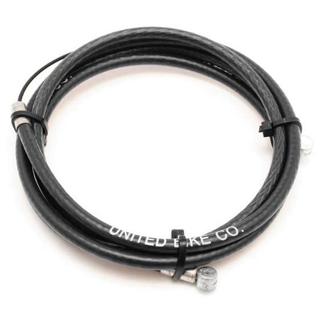 Coiled black bike brake cable with silver end cap, labeled "United Supreme Linear Cable" on a white background.