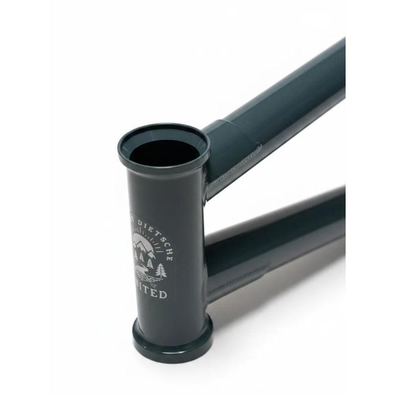 Close-up of the United Pro Model Frame (Marius Dietsche Signature) in dark green, highlighting a silver head tube logo, precise weld joints, and sections of the top and down tubes crafted from 4130 Sanko Japanese tubing.