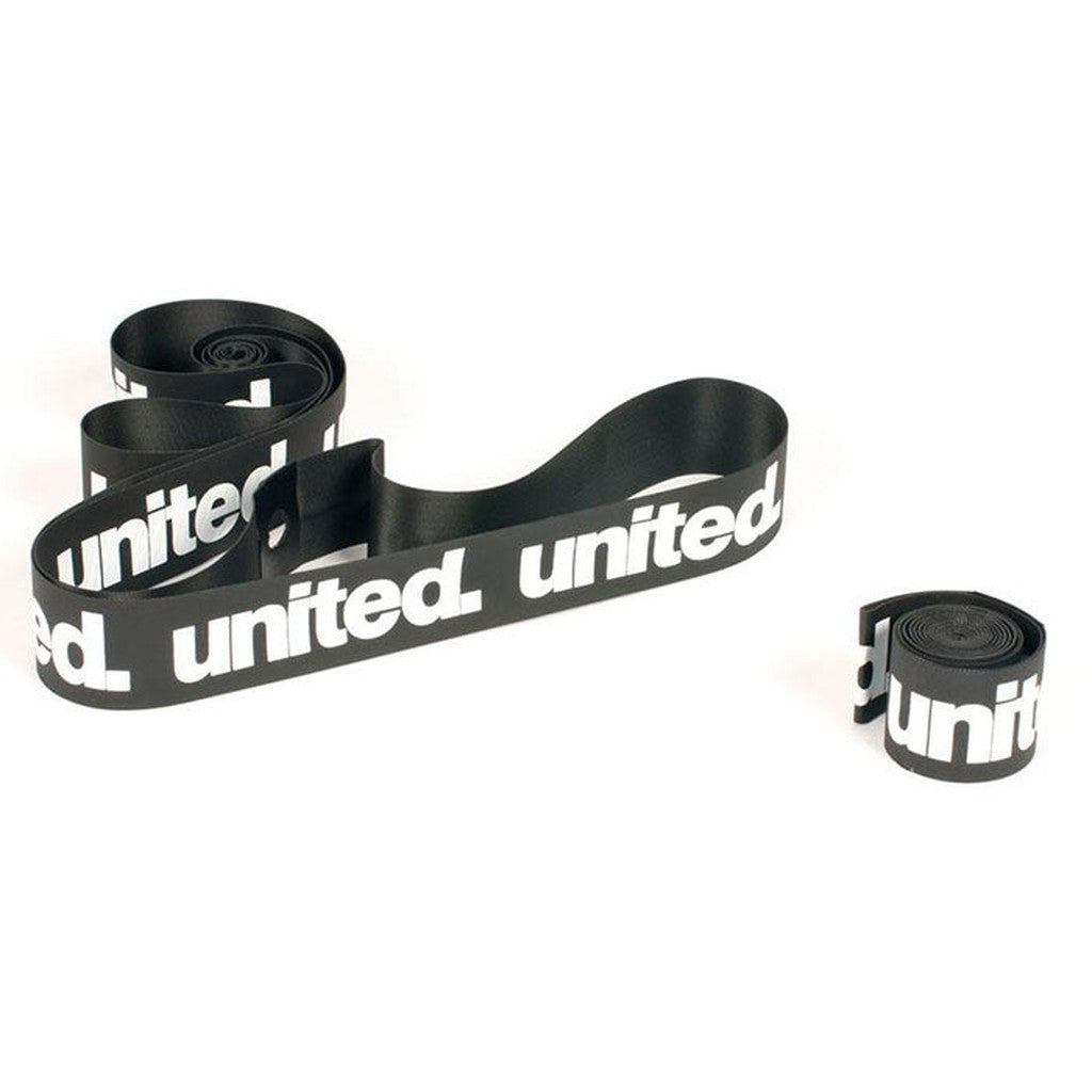 Black heavy-duty United Supreme Rim Strips (Pair) with the word "united" printed in white repeated along their length, coiled loosely on a white background.
