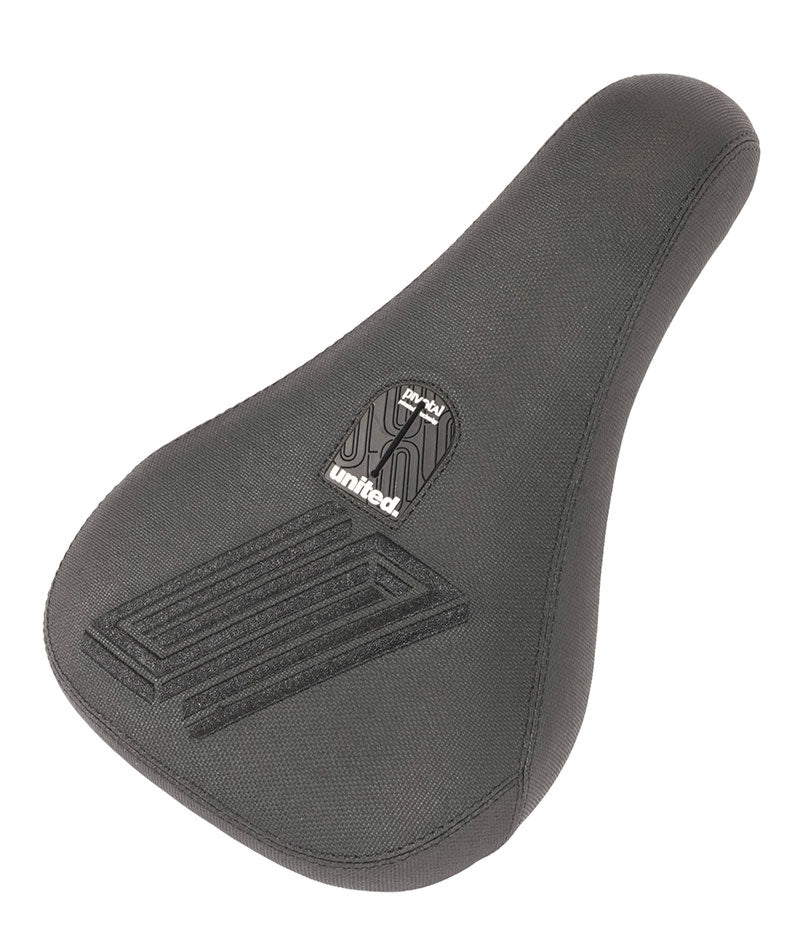 United Reborn Fat Pivotal Seat bicycle saddle with a textured cover and brand logo on the top, isolated on a white background.