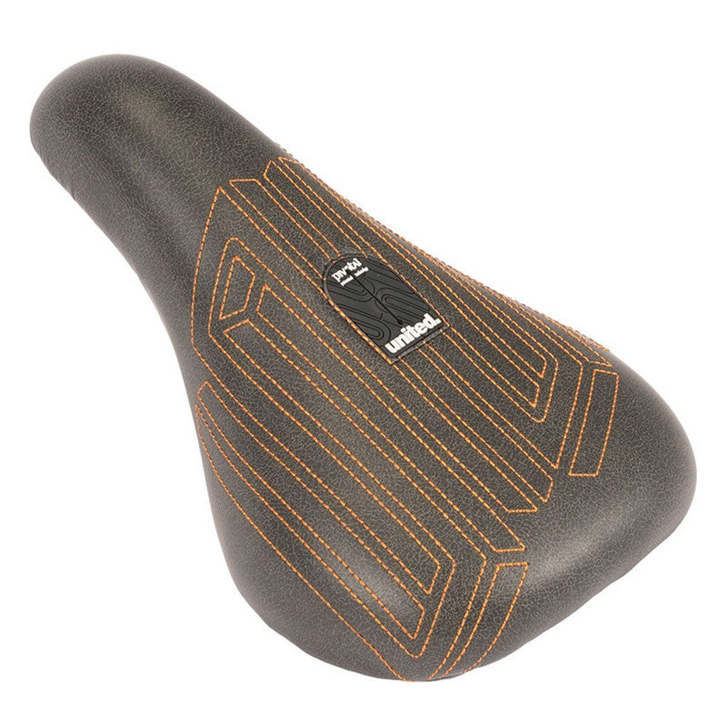 United Squad Fat Pivotal Seat with black bicycle saddle featuring orange stitching and textured pattern on the top.