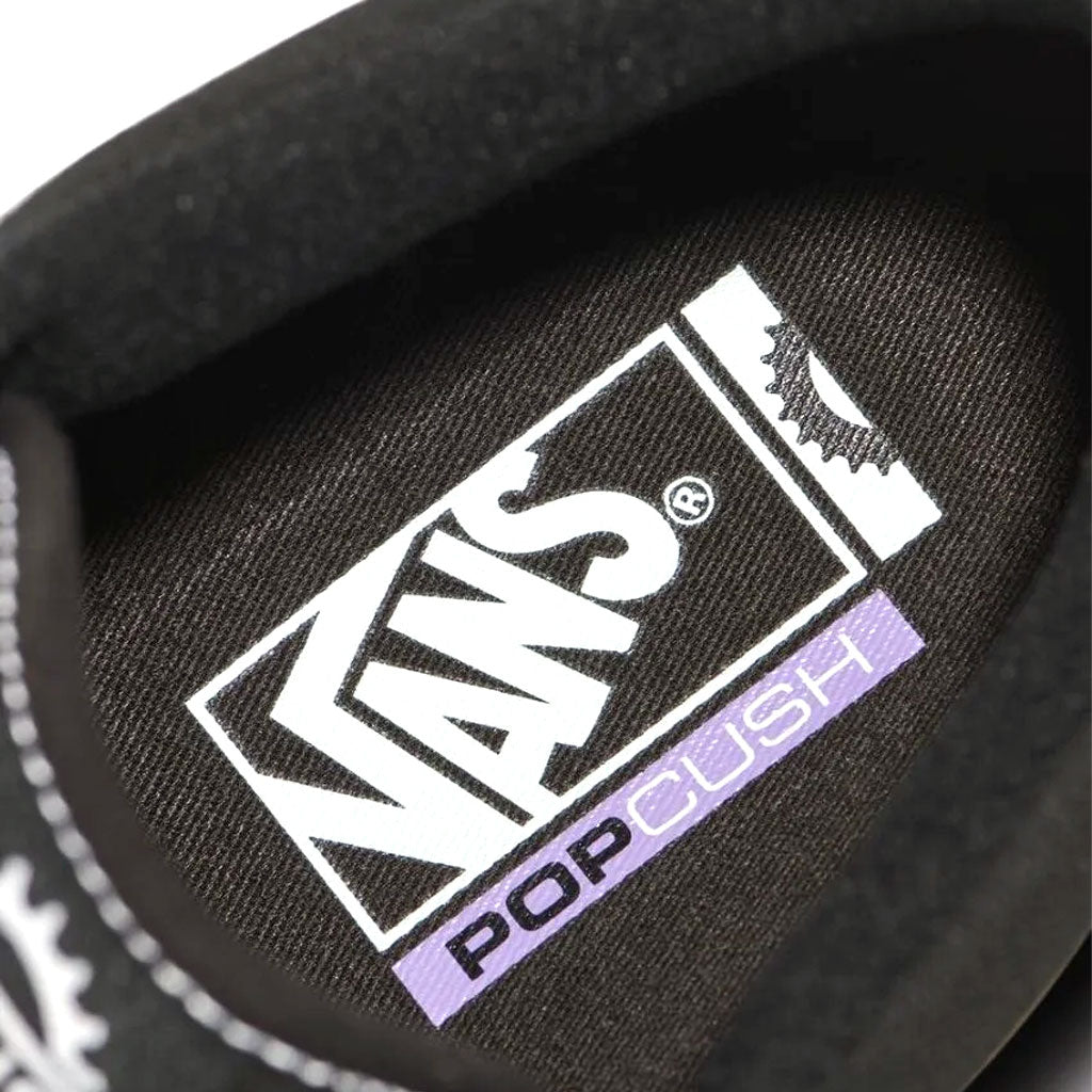 Close-up image of the insole of a Vans BMX Style 114 Black/White shoe featuring the Vans logo and the text "PopCush" in white and purple, highlighting superior cushioning for enhanced durability.