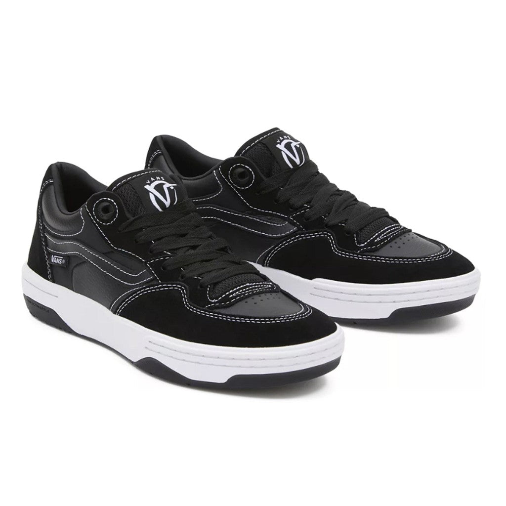 The Vans Rowan 2 Shoes - Black/White is a pair of black and white sneakers with white soles, perfect for skateboarding.