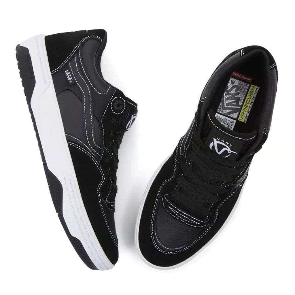 The Vans Rowan 2 Shoes - Black/White sneakers feature a sleek black and white design, perfect for skateboarding enthusiasts seeking optimal impact protection.