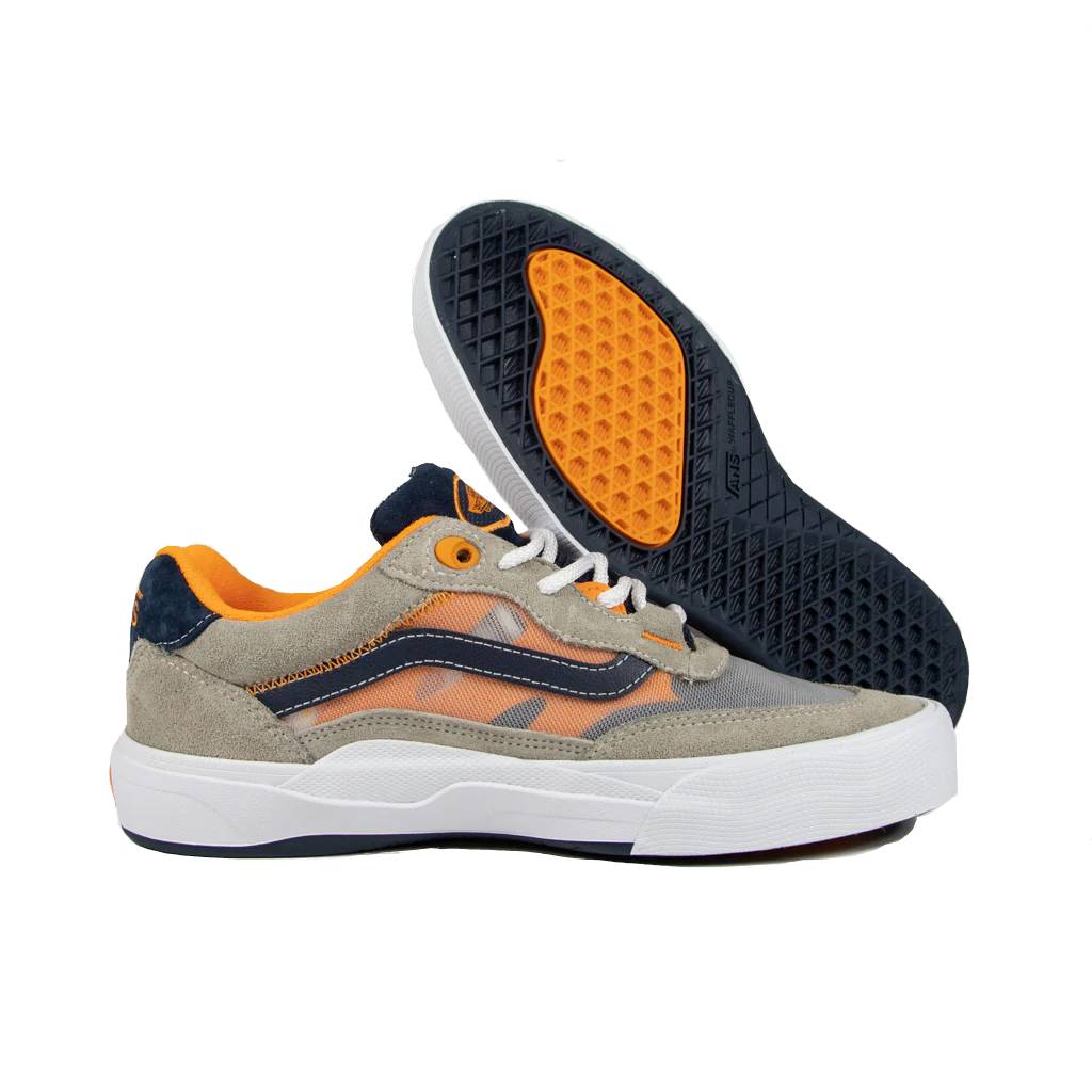 A pair of Vans Wayvee Pro Shoes in Smoke/Navy. One shoe is upright, showcasing its sleek design, while the other is tilted to reveal the tread pattern on the WAFFLECUP™ outsole and the durable DURACAP™ toe cap for enhanced performance.