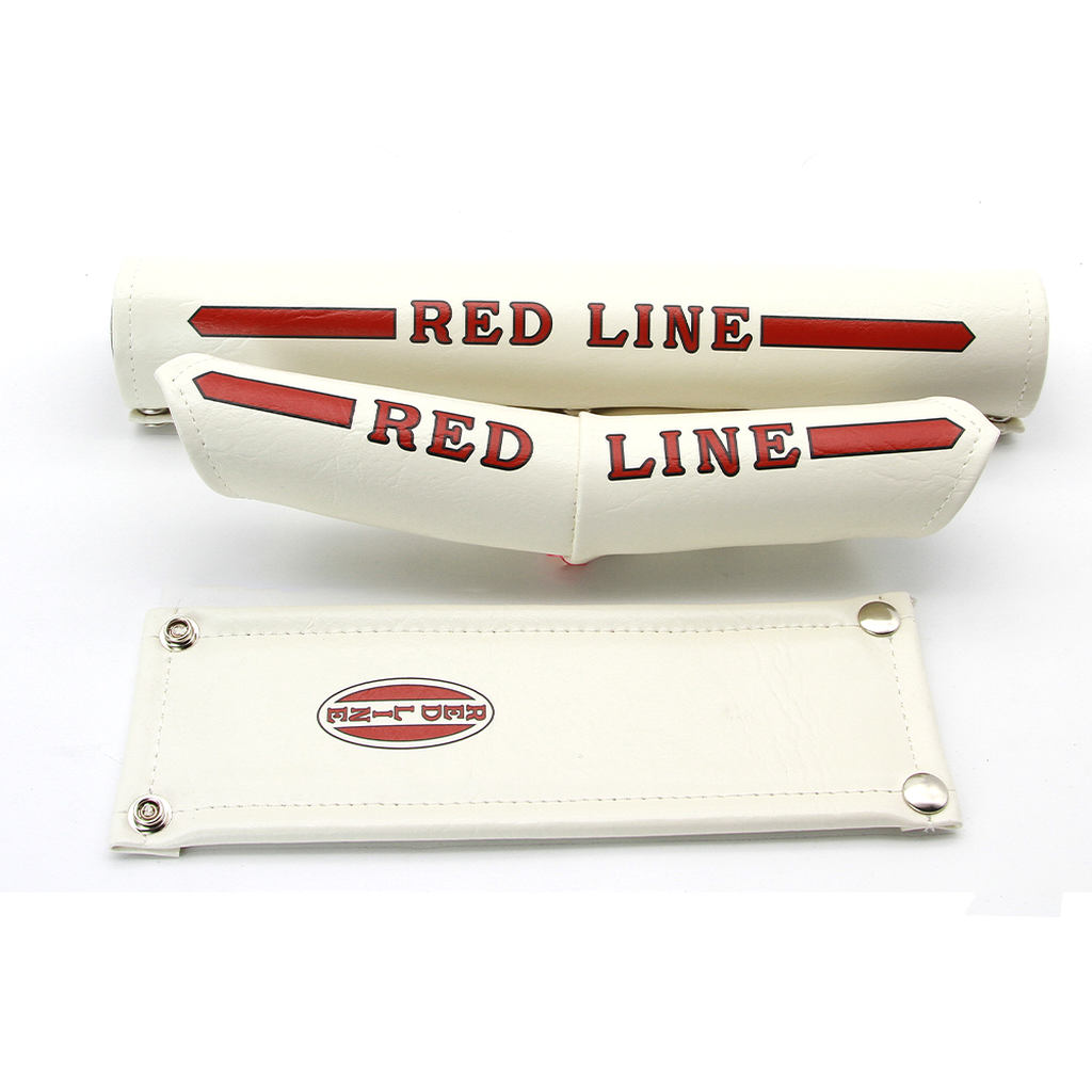 A pair of Redline Vinyl Studded Pad Set (V Bars) seat covers on a white surface.