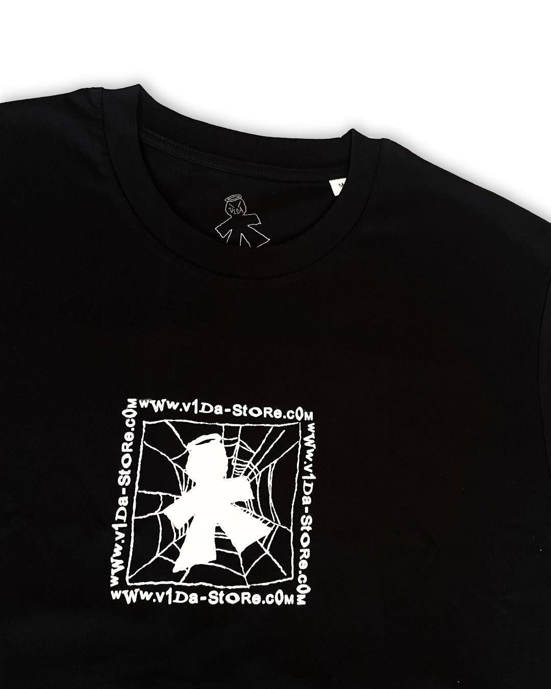 The V1da Web T-shirt is a black 100% cotton BMX tee with a white screenprint of a figure in front of a spider web and "www.v1da-store.com" repeated around the design.