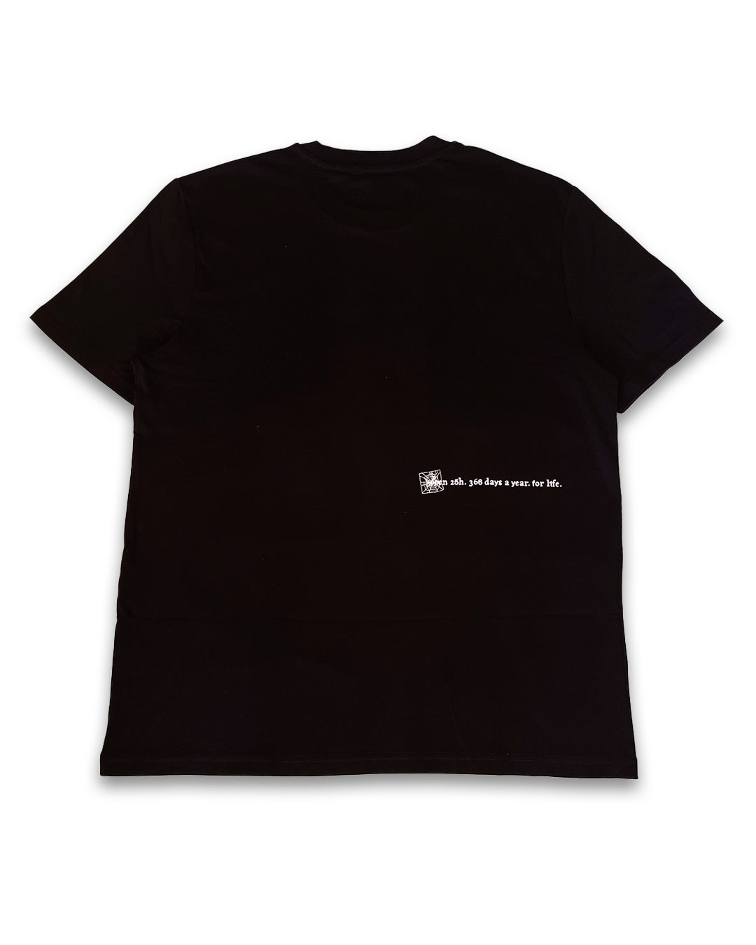 The V1da Web T-shirt in black is shown laid flat, back view, with a small white screenprint and "oh, 100 days since her life." text on the lower right. Made from 100% cotton for comfort.
