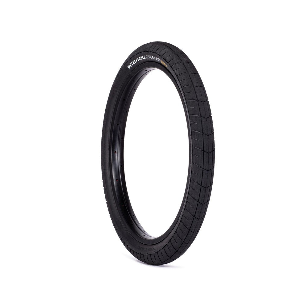 An all-terrain Wethepeople Activate Tyre (100 PSI) with a durable sticky compound, showcased on a white background.