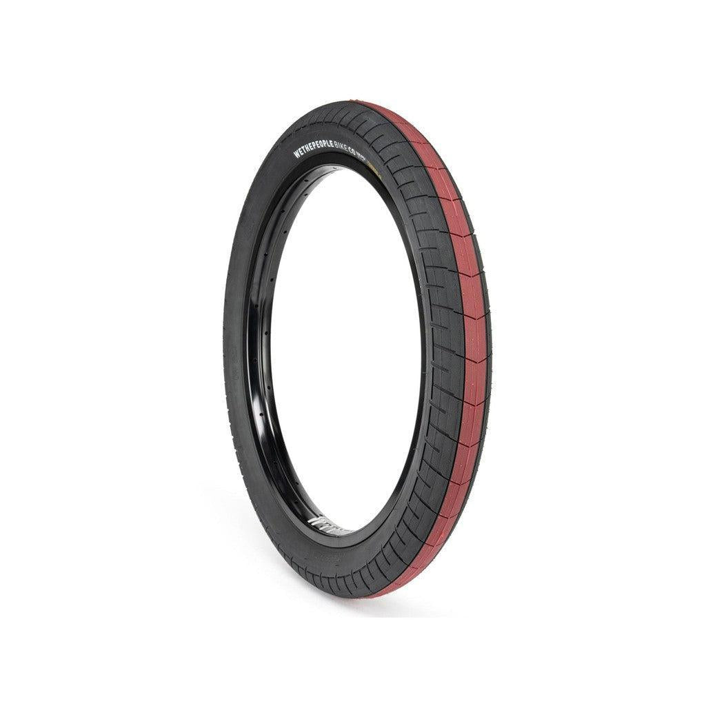 A 20-inch Wethepeople Activate 20 Inch Tyre (100 PSI) (Each) with a black sidewall and a dark red all-terrain tread pattern mounted on a black rim.