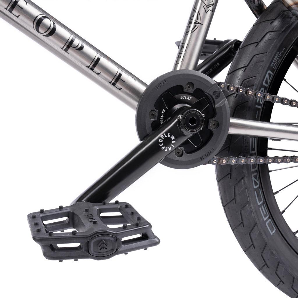 Close-up of a Wethepeople Battleship 20 Inch Bike's pedal, crank arm, chainring, and rear wheel with detailed Eclat components and part of the branded chromoly frame.