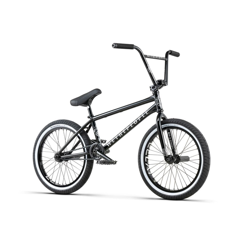 The Wethepeople Battleship 20 Inch Bike, featuring a sleek black Chromoly frame, straight top tube, wide handlebars, and thick tires, is displayed on a white background.