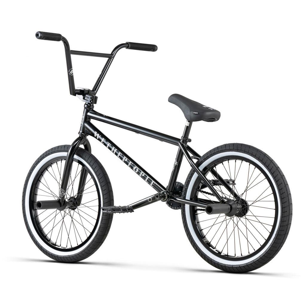 The Wethepeople Battleship 20 Inch Bike features a black Chromoly frame, Eclat components, pegs on both front and rear wheels, a straight handlebar, and thick tires, pictured on a white background.