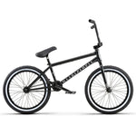 The Wethepeople Battleship 20 Inch Bike is a black BMX with a straight top tube, thick tires, "We The People" branding on its chromoly frame, and Eclat components, shown side-on against a white background.
