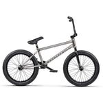 The Wethepeople Battleship 20 Inch Bike is a silver BMX with a durable Chromoly frame, black tires, seat, and handlebars, shown on a white background.