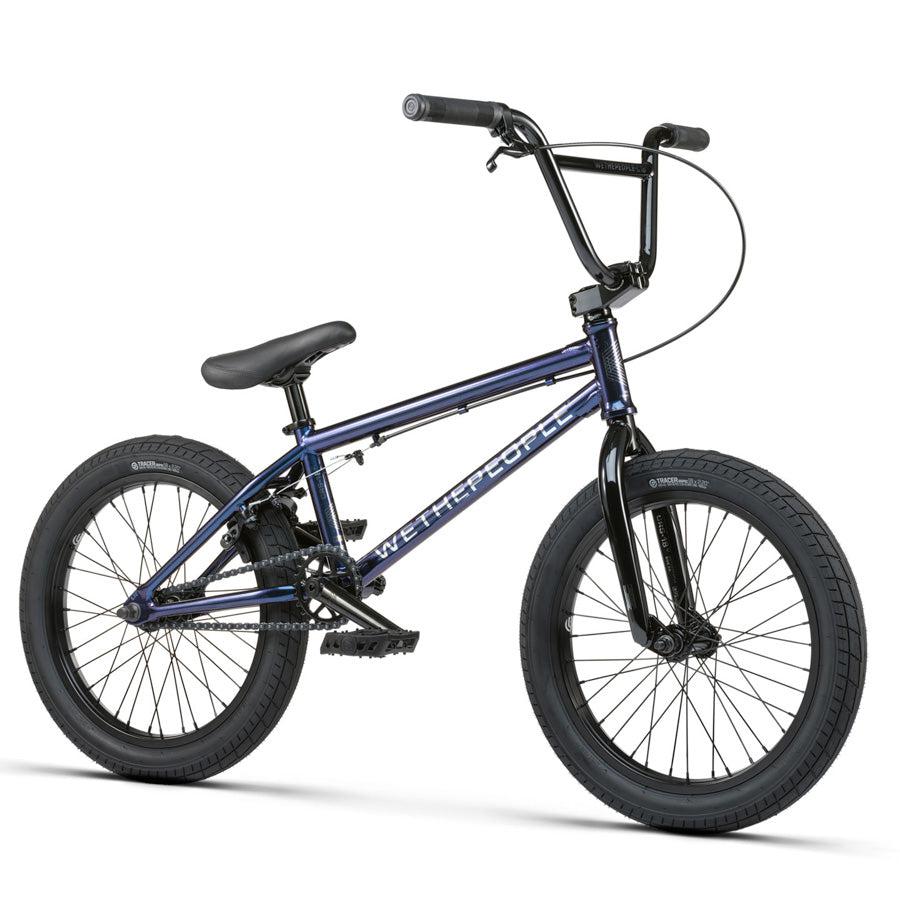 A Wethepeople CRS 18 Inch Bike for kids in blue, featuring black tires, a black seat, and "WeThePeople" branding on the frame, shown against a white background.
