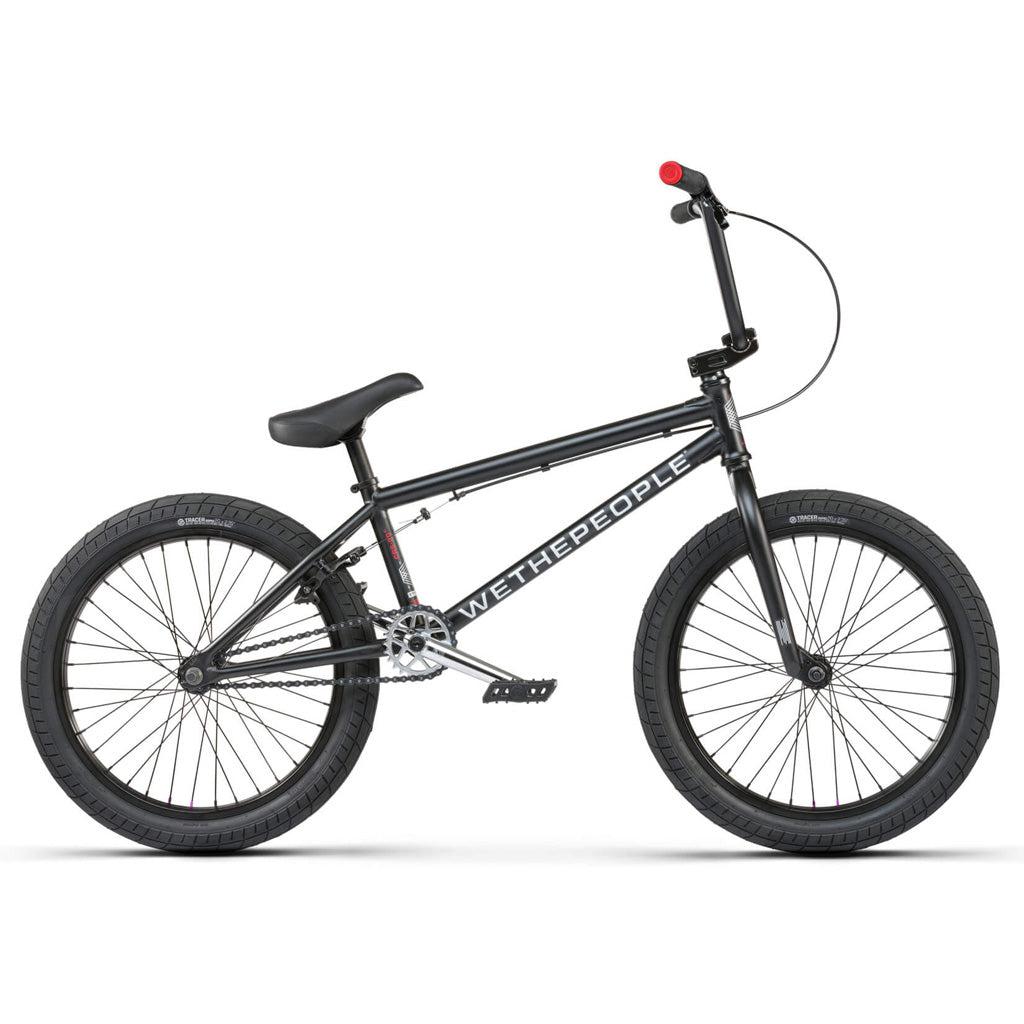 A black Wethepeople CRS 20 Inch Bike with Salt Rookie Chromoly Three Piece Cranks and Eclat Surge Pedals on a white background.