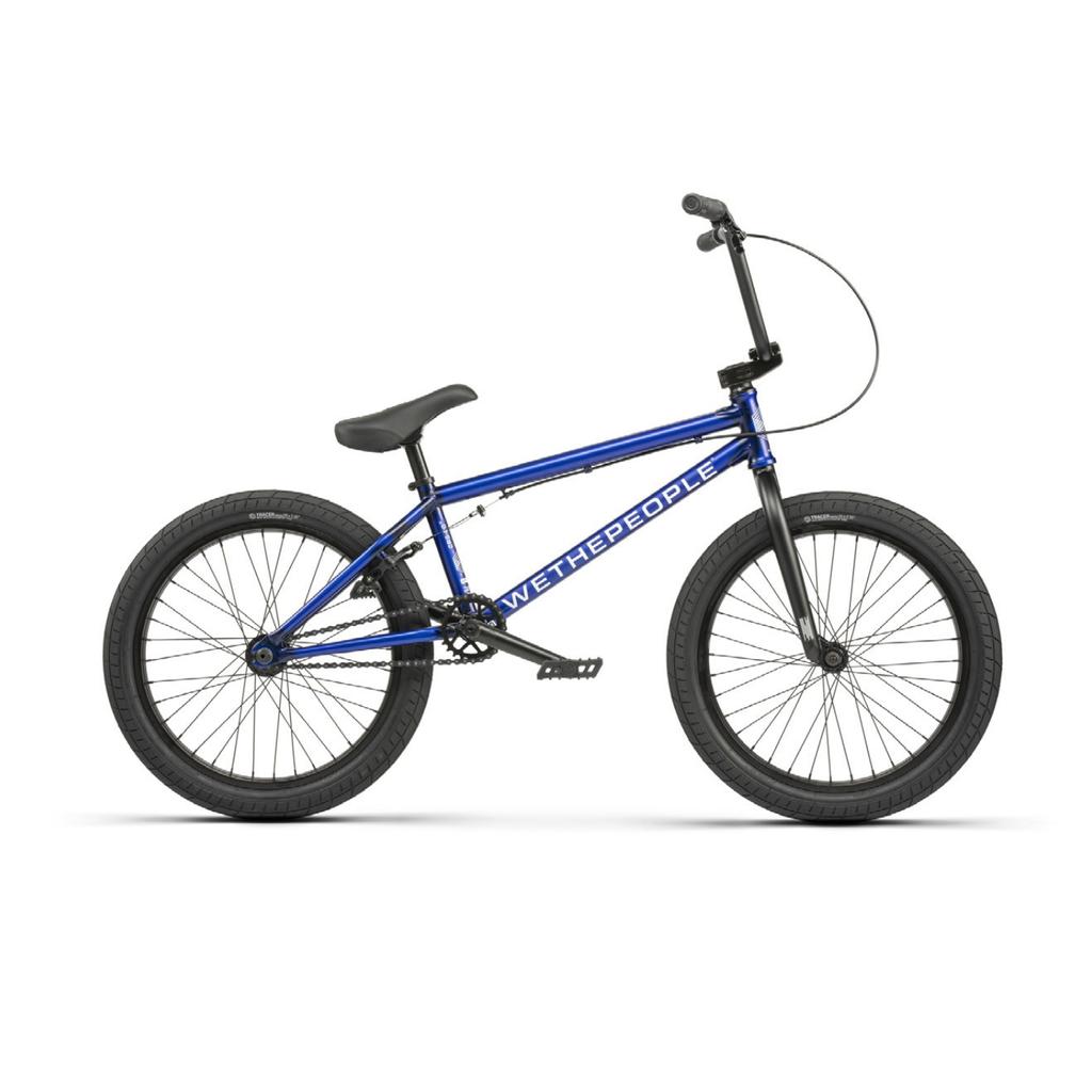 The Wethepeople CRS 20 Inch Bike is blue with a black seat, handlebars, and tires. It features "WETHEPEOPLE" on the frame and is designed for an agile ride, incorporating aftermarket parts for enhanced performance and style.