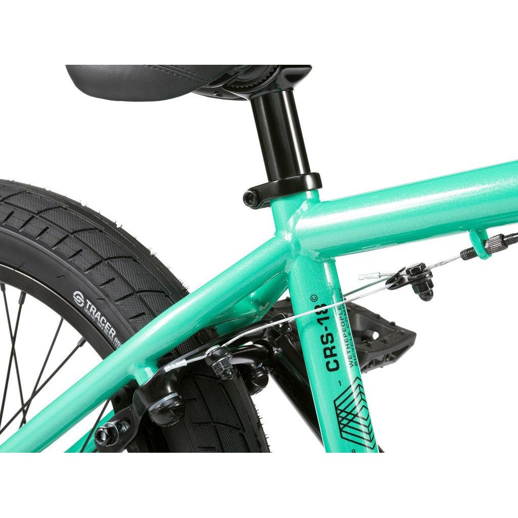 Close-up of the rear section of the Wethepeople CRS FS 18 Inch Bike showing the seat, seat post, 18-inch rear wheel, and gyro-equipped brake mechanism.