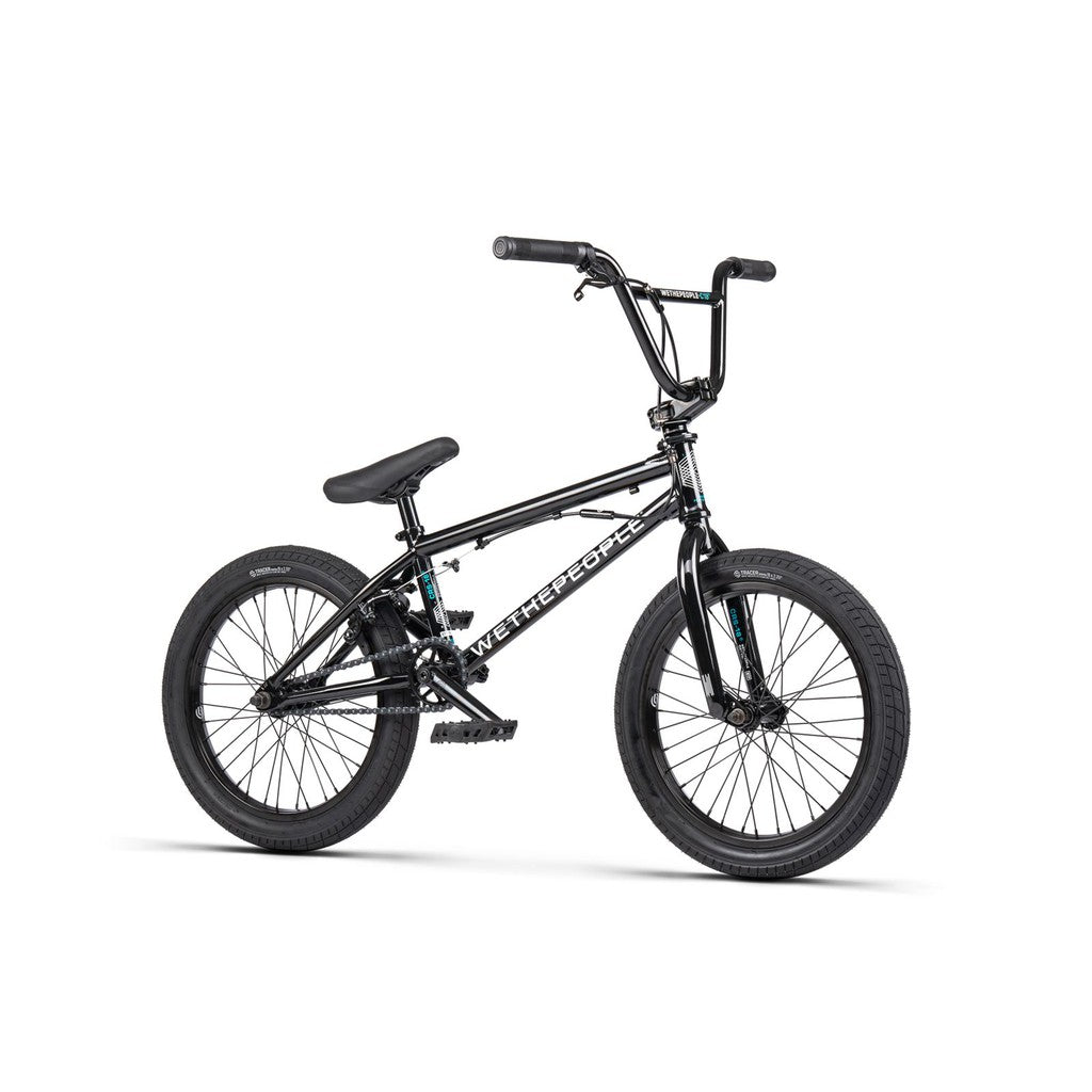 The Wethepeople CRS FS 18 Inch Bike is a black BMX freestyle bike featuring a compact 18" frame, thick tires, straight handlebars, and bold “WE THE PEOPLE” branding on the frame.