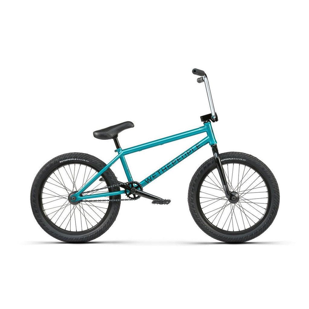 A Wethepeople Crysis 20 Inch Bike in teal, shown in profile against a white background, features black seat, handlebars, and tires with a durable 4130 Chromoly frame.
