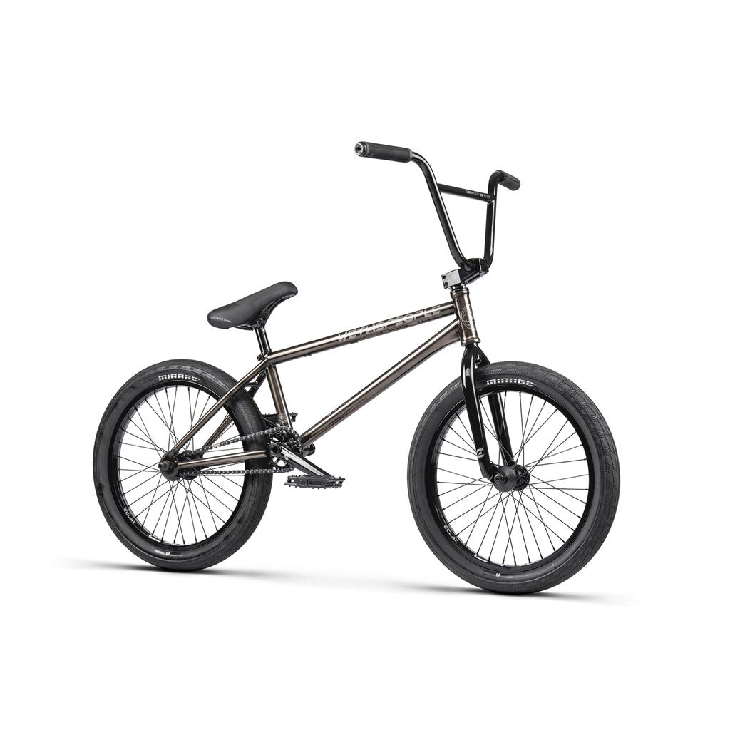 The Wethepeople Envy 20 Inch Bike is a BMX masterpiece with a metallic frame, black handlebars, and tires. This sleek, single-gear bike lacks fenders and a kickstand, embodying minimalistic design.