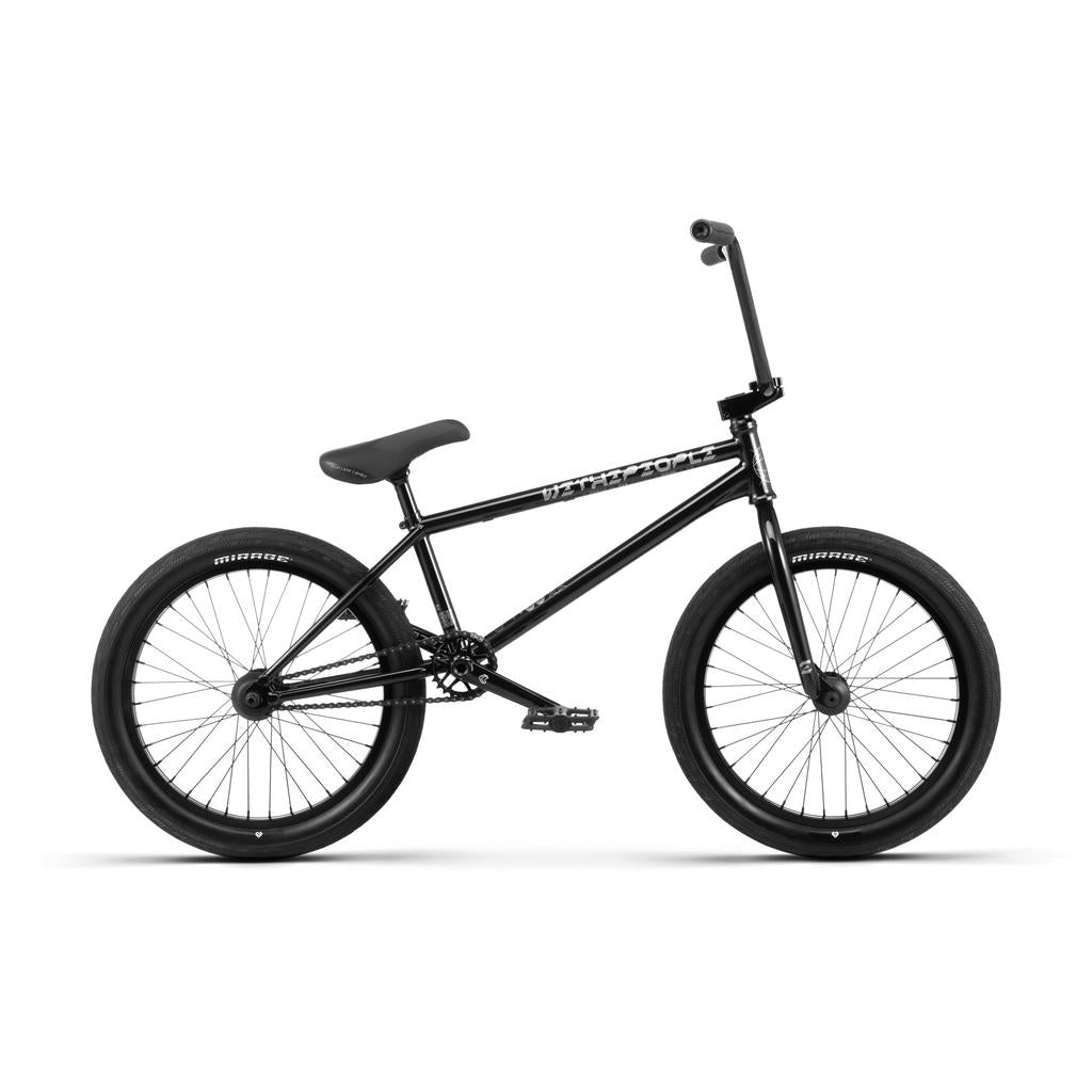 A Wethepeople Envy 20 Inch BMX bike in black, featuring thick tires, Eclat components, a straight top tube, and a padded seat, shown from the side on a white background.