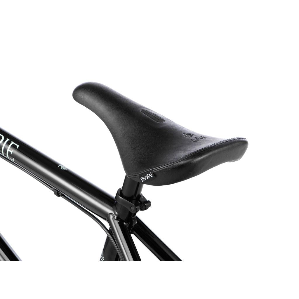 Close-up of the black saddle and disc brake on the Wethepeople Havoc 20 Inch Bike, featuring a black Chromo frame against a white background.