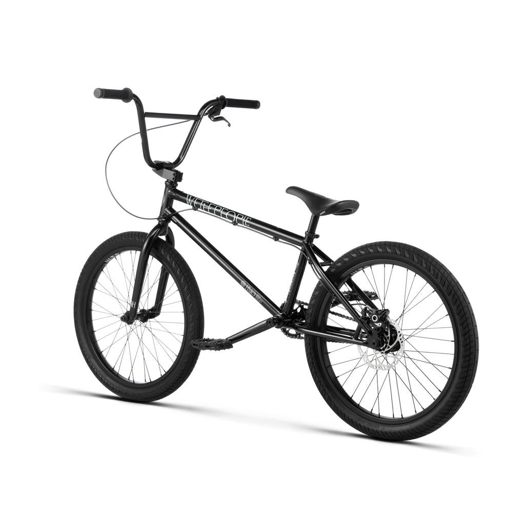 The Wethepeople Havoc 22 Inch Bike features a robust frame, thick tires, and freestyle handlebars—shown from the rear-side on a white background and disc brake-ready for optimal performance.
