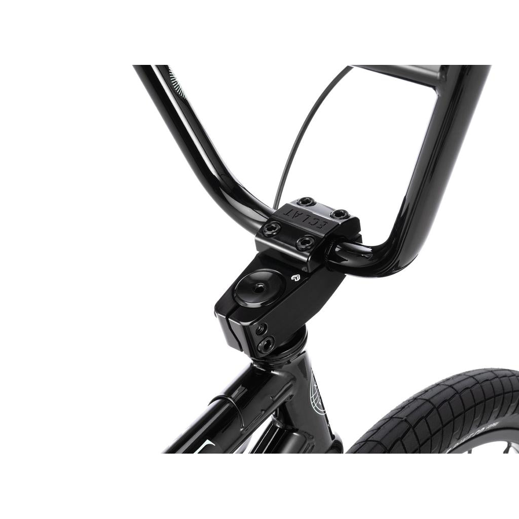 Close-up of the handlebar and stem of a black Wethepeople Havoc 22 Inch Bike, featuring the front wheel, frame, and a fork ready for disc brakes.