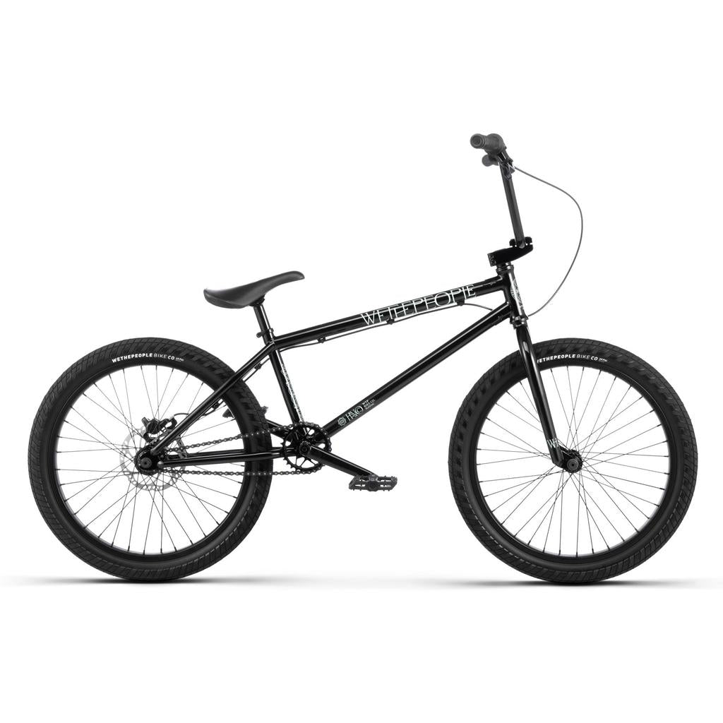 A black Wethepeople Havoc 22 Inch Bike with thick tires, straight handlebars, and a compact frame is shown in profile on a white background. This freestyle BMX is disc brake-ready for improved stopping power.