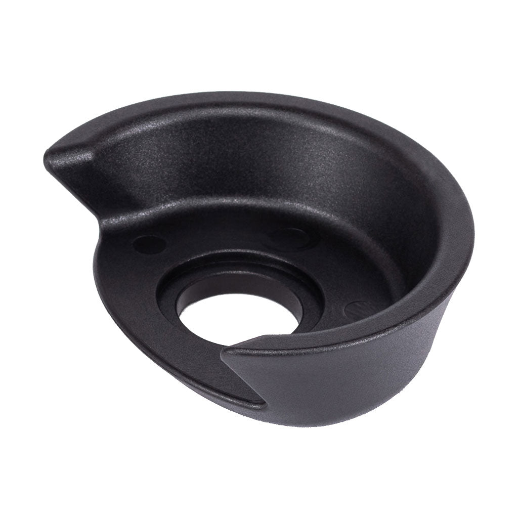 The WETHEPEOPLE Helix/Hybrid Rear Hub Driverguard is a black, semi-circular component with a central hole and raised edge, designed to protect your hub for smoother grinding and increased durability—ideal as a freecoaster hub guard.