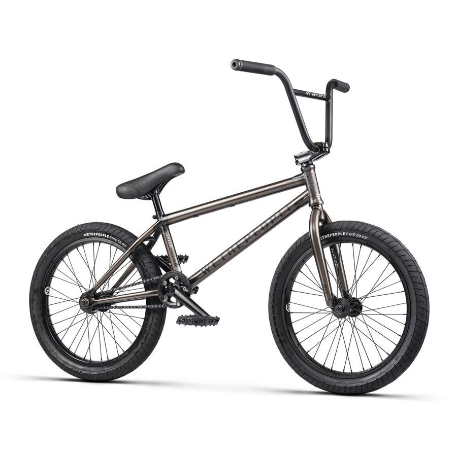 A Wethepeople Justice 20 Inch Bike with a black frame, black handlebars, black saddle, and black wheels stands proudly on a white background, showcasing its top-of-the-line BMX components.