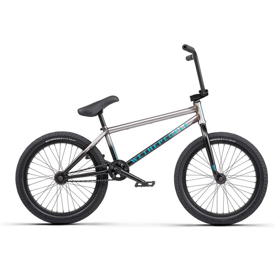 A Wethepeople Justice 20 Inch Bike in black and silver with top-of-the-line components, featuring "WeThePeople" branding on the frame, and black handlebars, seat, and tires. Side profile view.