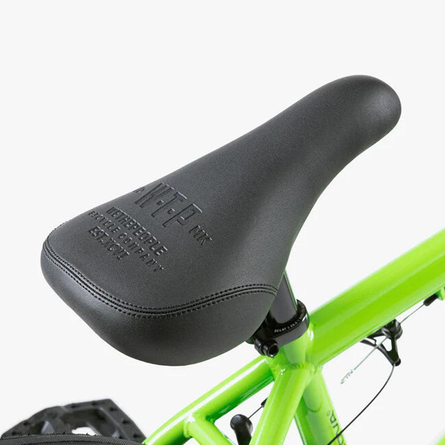 A close up of a green Wethepeople Nova 20 Inch BMX Bike seat.
