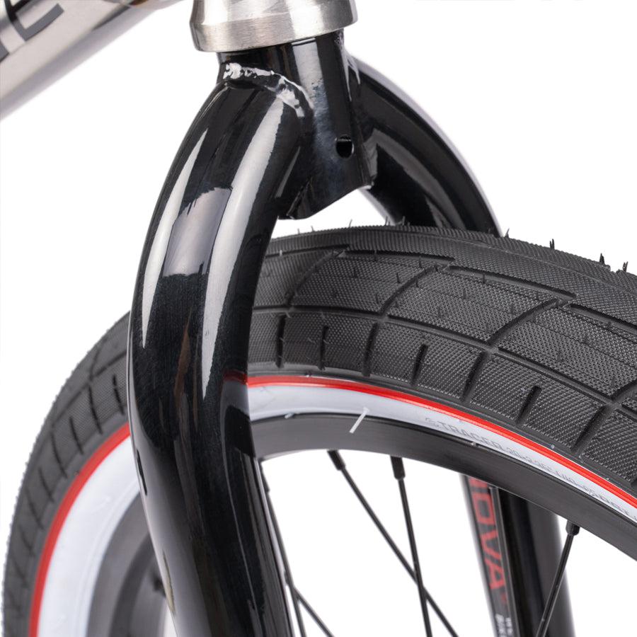 A close up of a Wethepeople Nova 20 Inch BMX Bike with a tire on it.