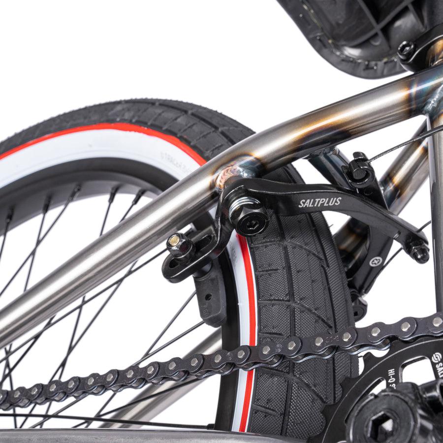 A close up of a Wethepeople Nova 20 Inch BMX Bike with a chain on it.