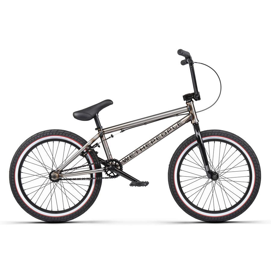 The Wethepeople Nova 20 Inch Bike boasts a sleek metallic frame, black seat, and red-accented tires. It's enhanced by sturdy Salt Rookie Cranks, all presented against a crisp white background.