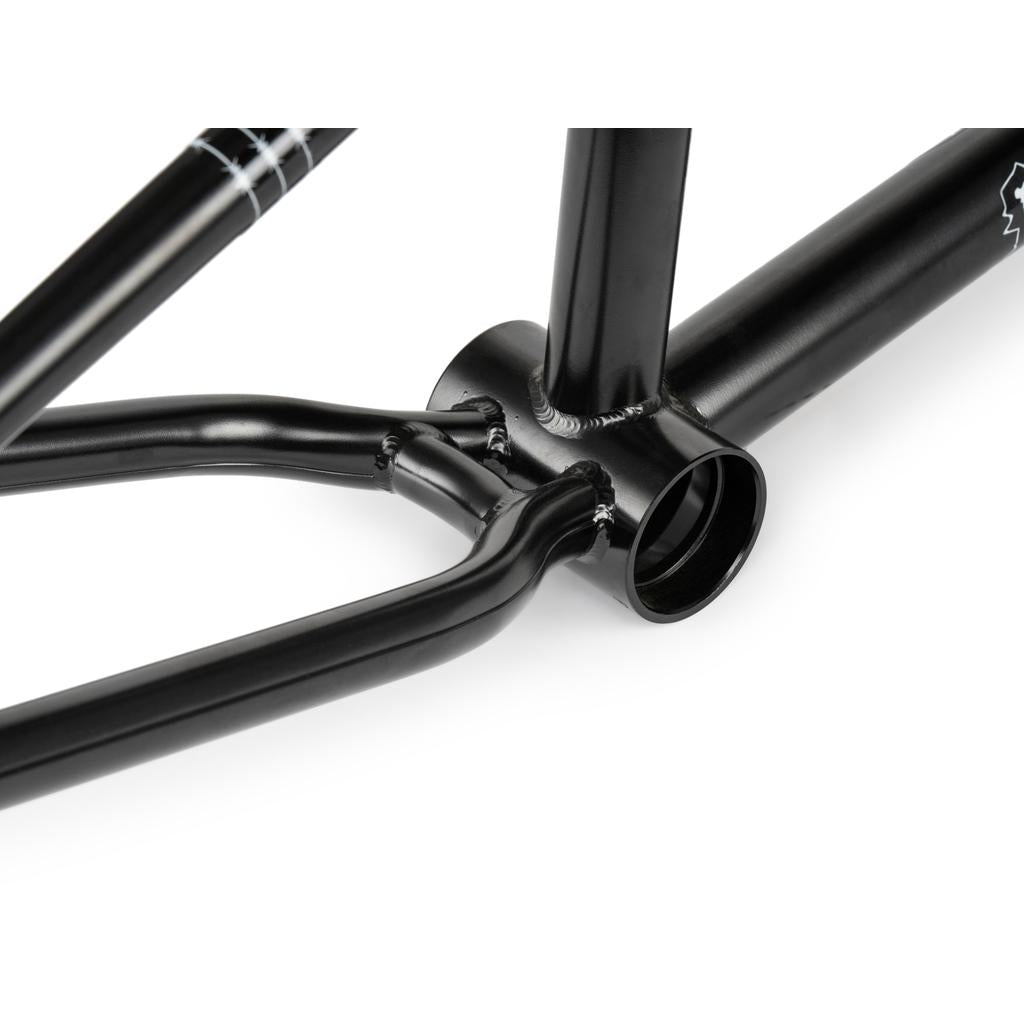 Close-up of the Wethepeople Pathfinder Frame in black, focusing on the bottom bracket and chainstay junction with detailed welding inspired by Felix Prangenberg.