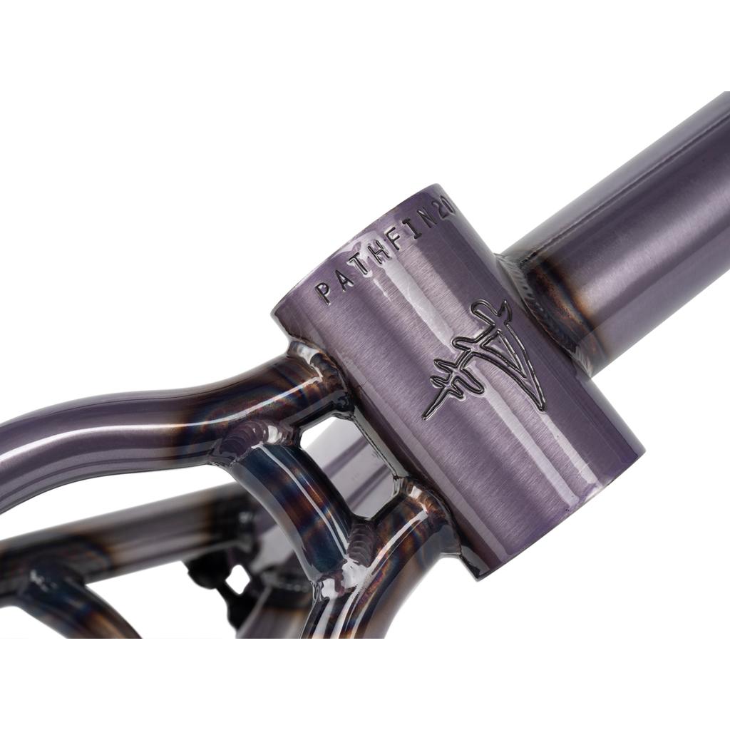 A close-up of the Wethepeople Pathfinder Frame shows "PATHFINDER" and a stylized logo engraved on the head tube, highlighting clean welds and a vibrant purple finish inspired by Felix Prangenberg.