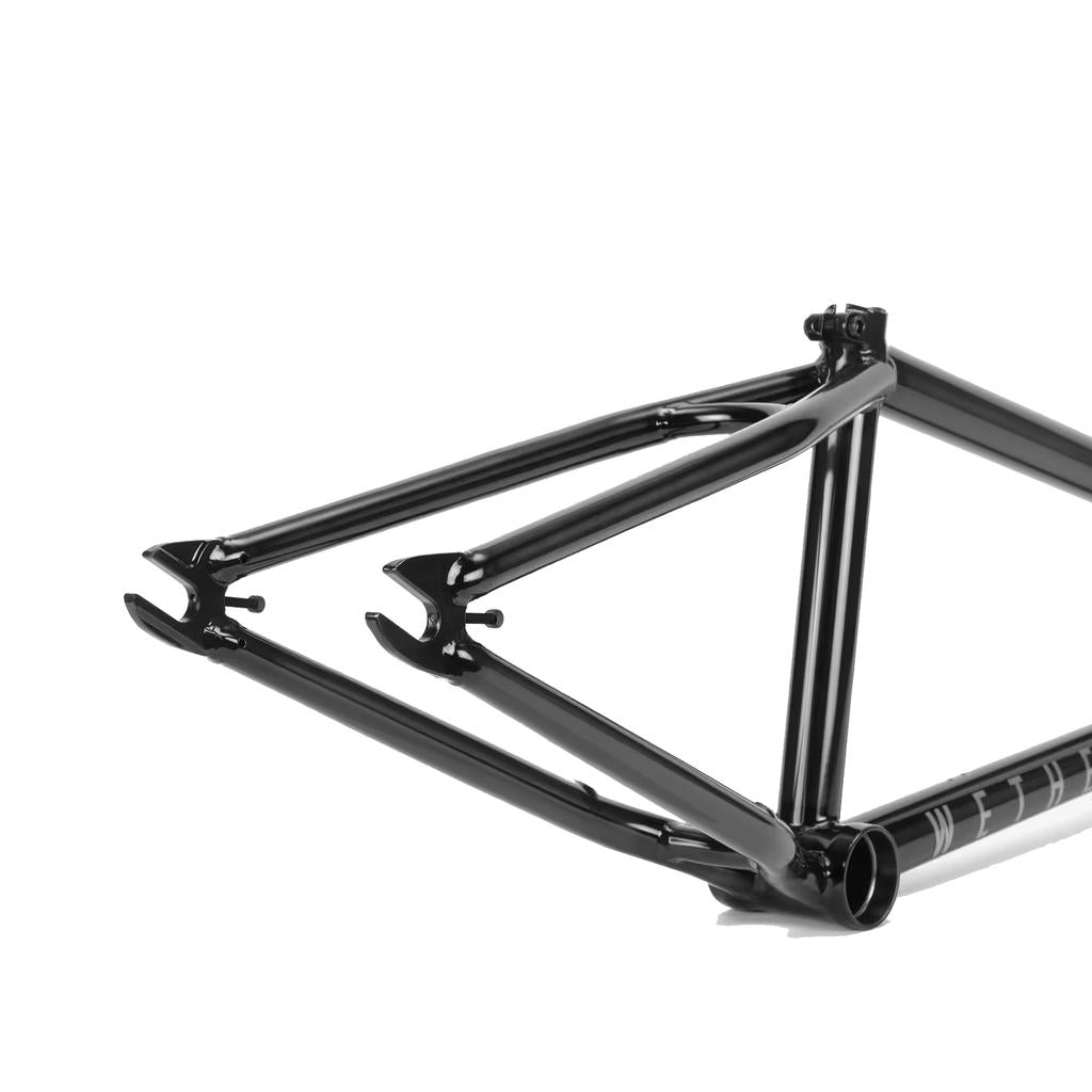 Close-up of the Wethepeople Patrol Frame in black, focusing on the rear dropout and chainstays, highlighting rear triangle clearance against a clean white background.